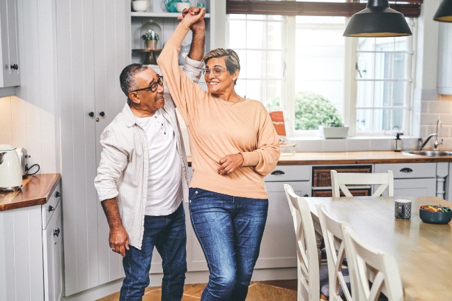 Couple dancing in the kitchen | Surgical weight loss