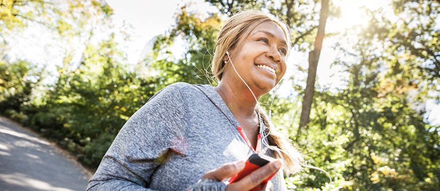 woman running with headphones in