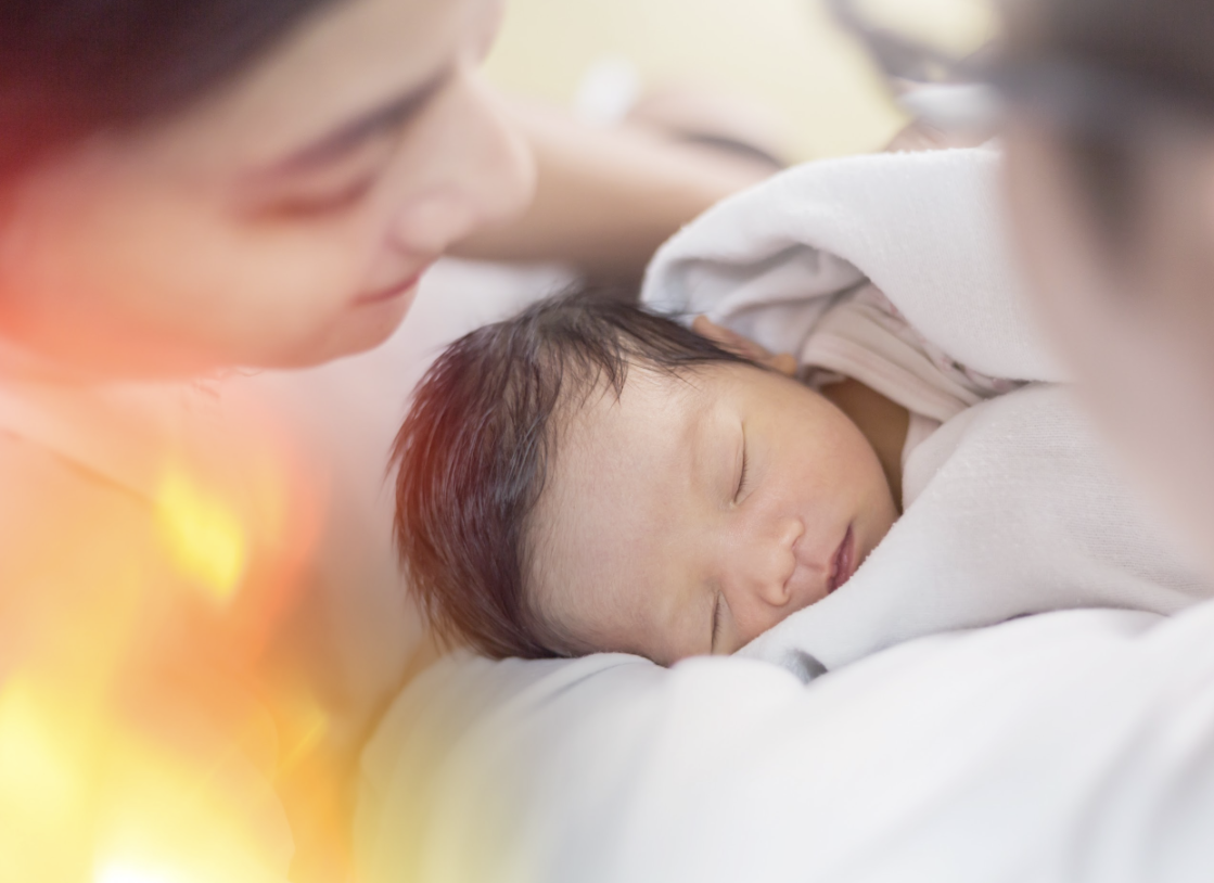 Parents looking at newborn baby