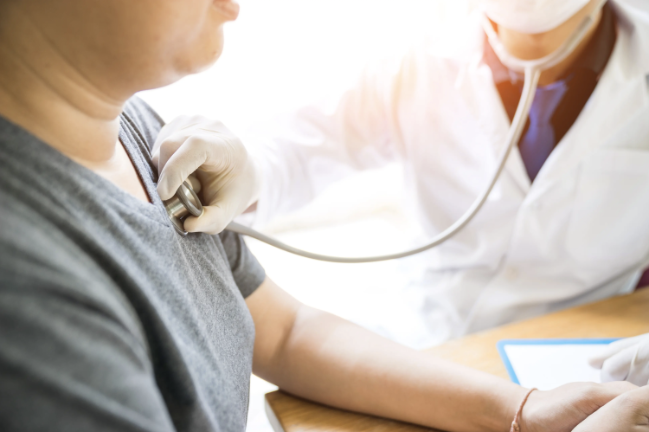 Heart and Vascular care in Las Vegas and Henderson, NV Doctor listening to patient's heart with stethescope