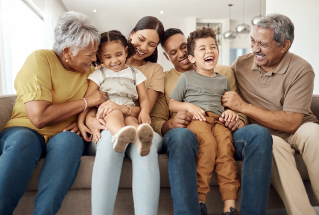 Heart and Vascular care in Las Vegas and Henderson, NV Family sitting on couch laughing together